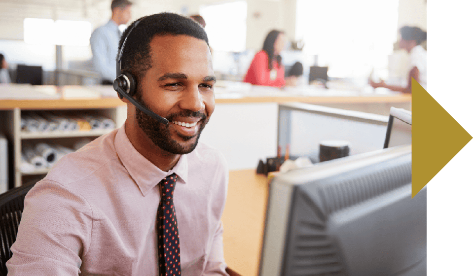 Customer service representative with headset smiling at computer in call center office for Bayou Star Search SEO keyword focus.